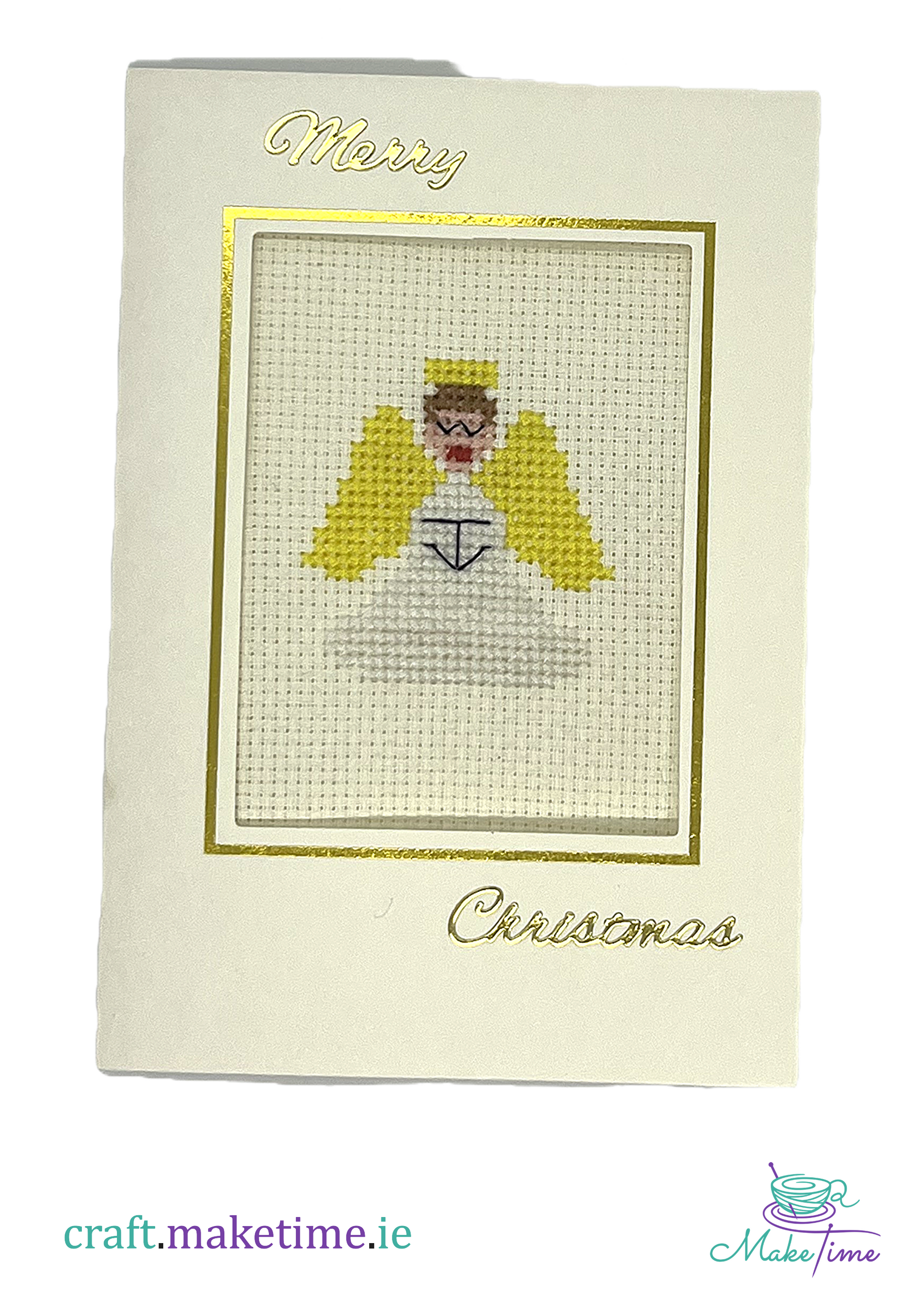 Cross-stitched angel on a Christmas card with 'Merry Christmas' text.
