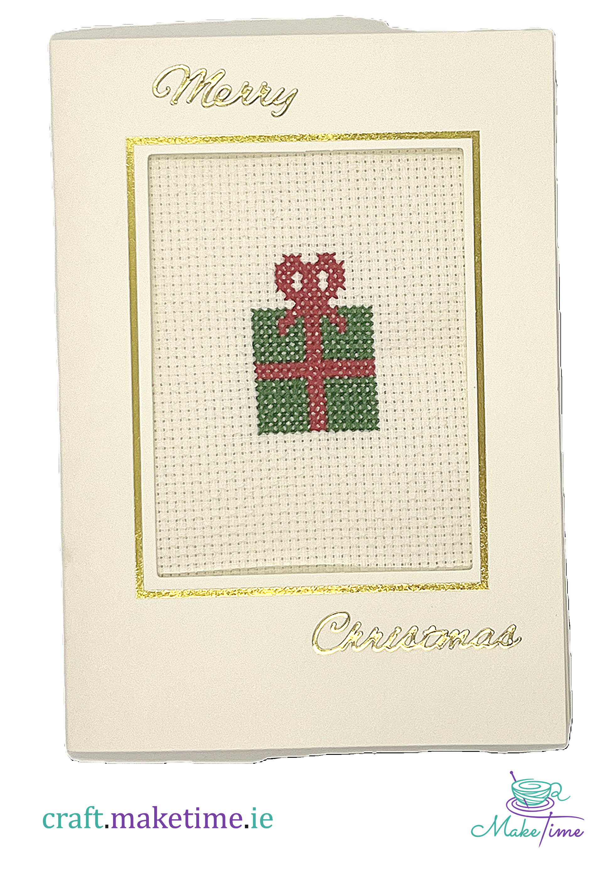 Cross-stitched Christmas gift box on a cream card with 'Merry Christmas' text.