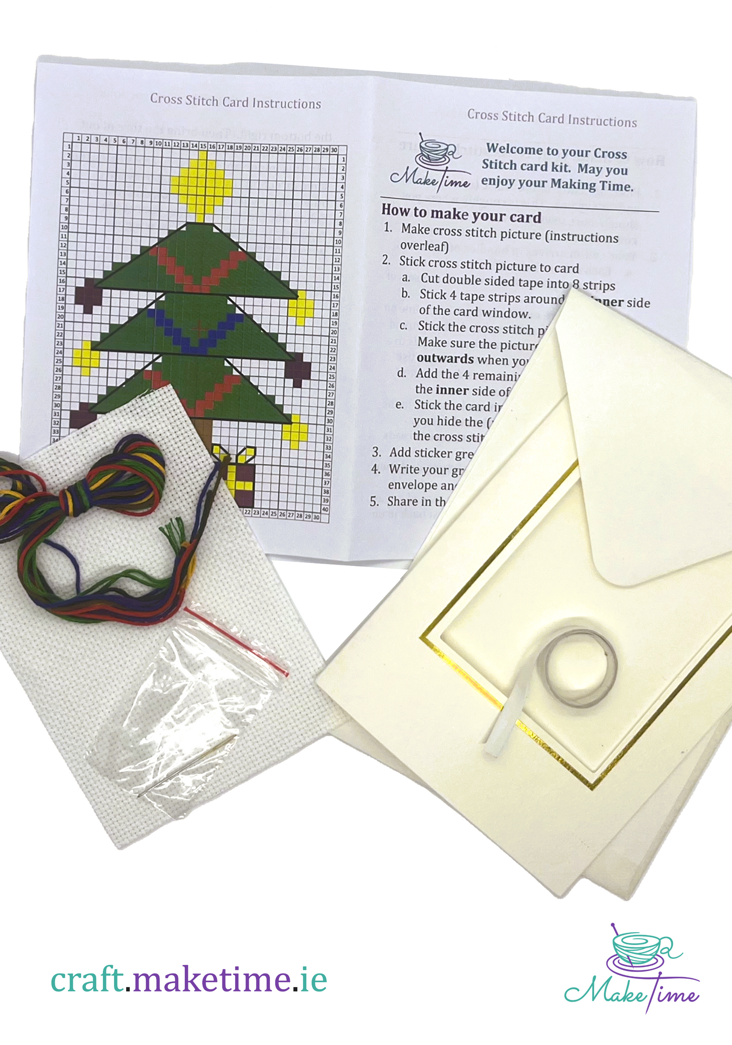 Christmas tree Cross stitch card kit with pattern, thread, and envelope on a white background