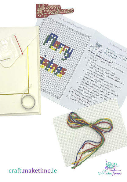 Merry Christmas Cross-stitch kit with pattern, thread, and instructions on a white background