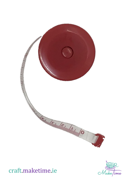 Red tape measure with a white background