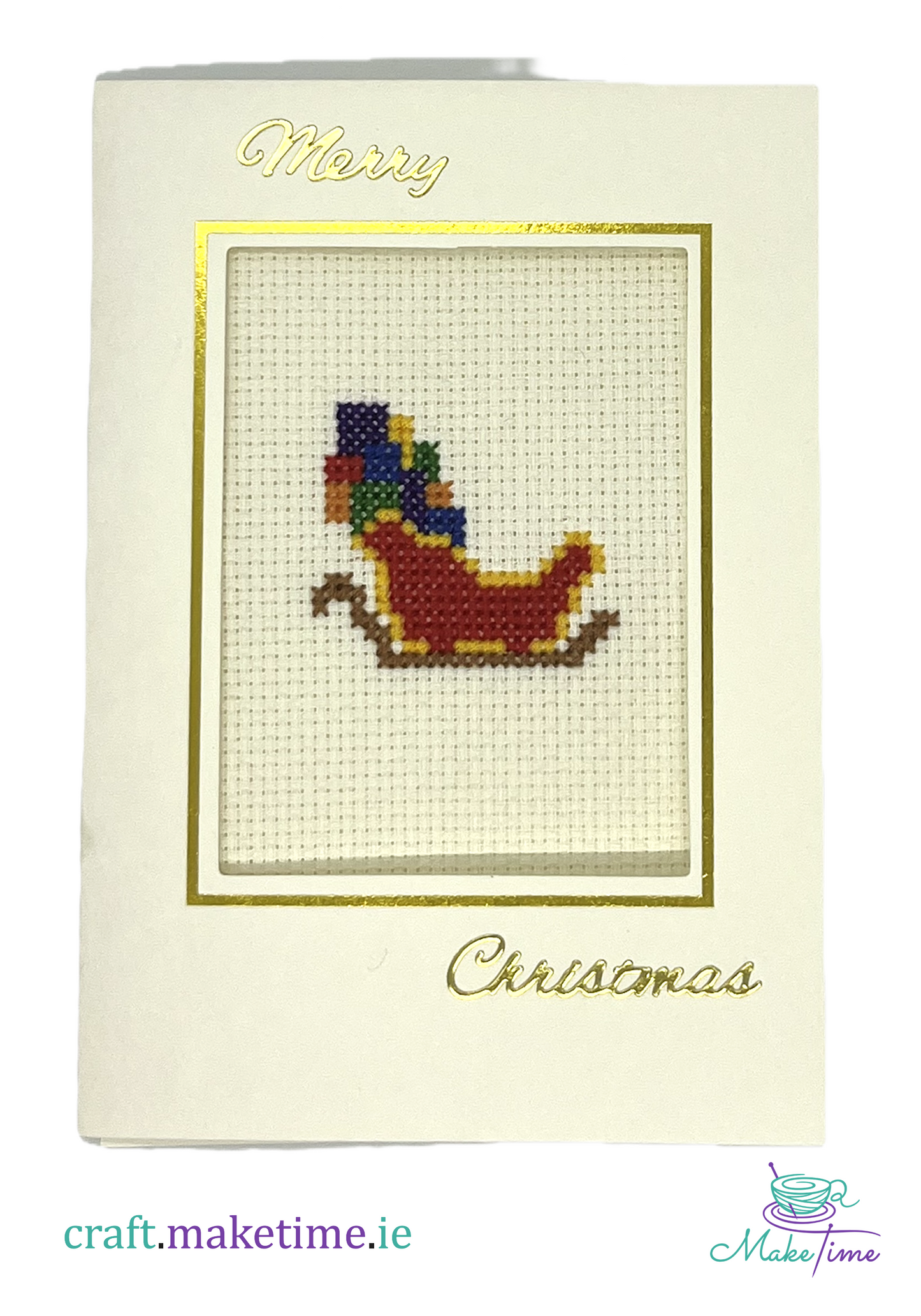 Cross-stitched Christmas card with a santa's sleigh full of presents design on a white background